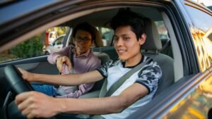 Learning to drive. Two young men in a driving session