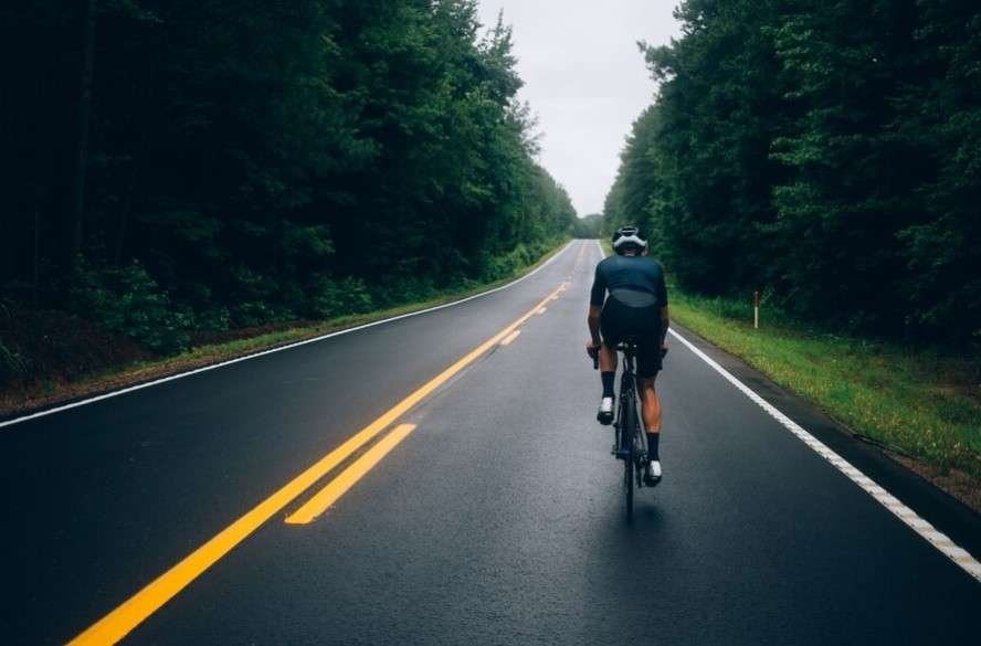 Man riding electric bike on road