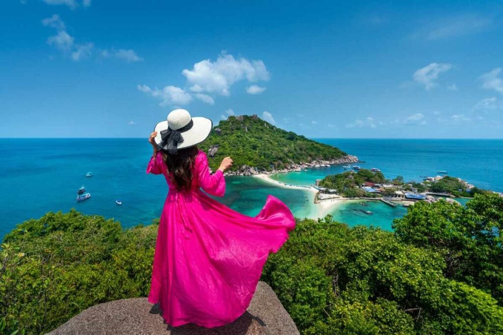 A girl with pink dress standing viewpoint near Hong Island
