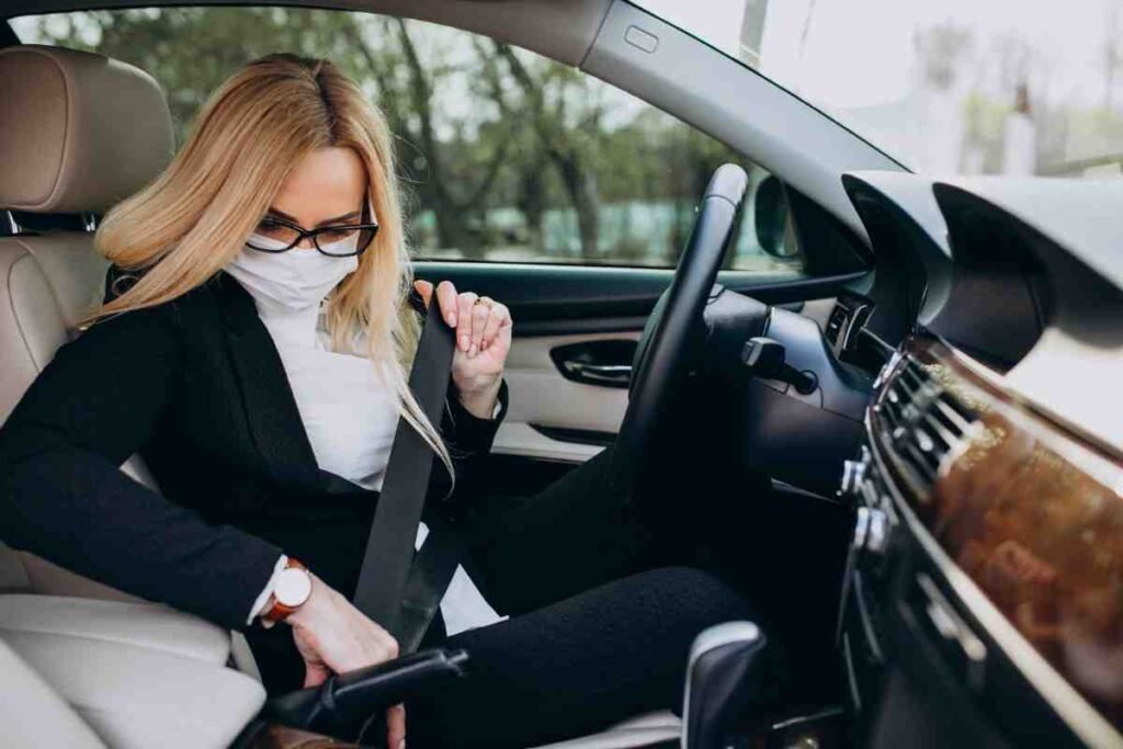 A masked girl in car