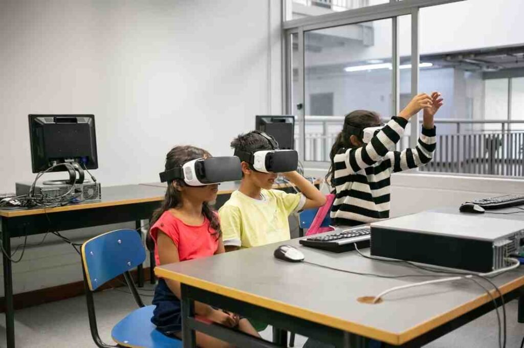 Cute multiethnic kids learning to use virtual reality glasses as a part of student engagement strategies
