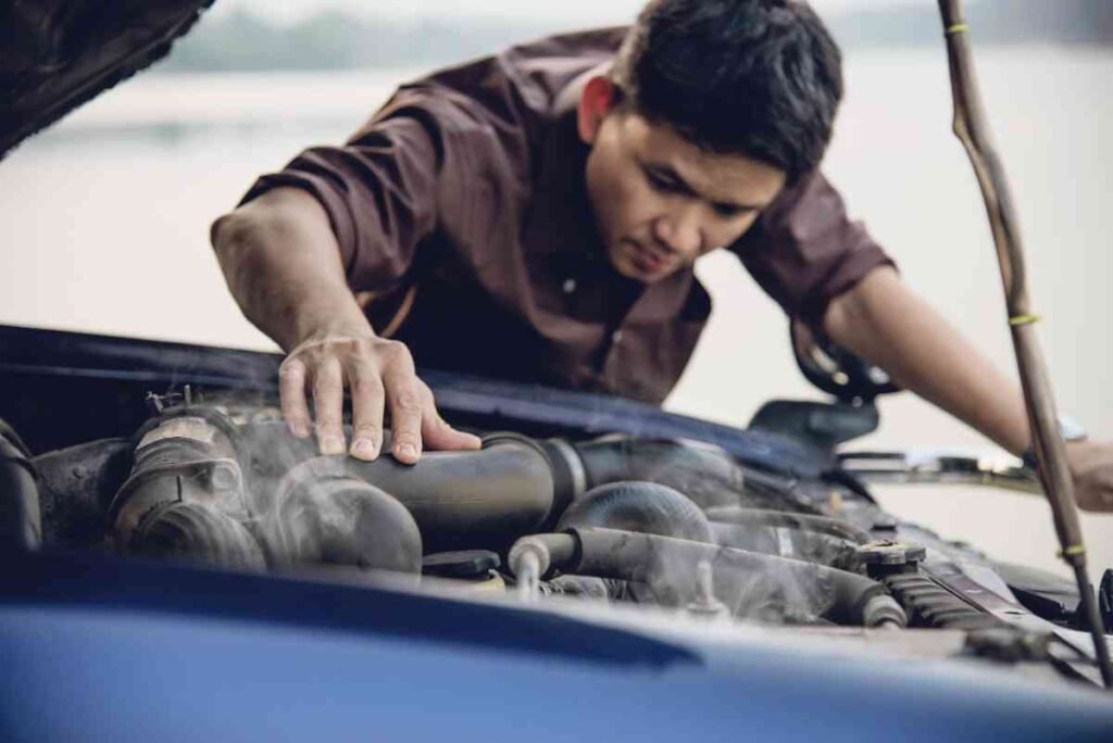 man trying fix car gas smell problem