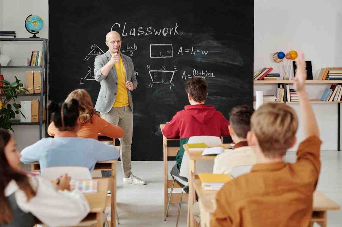 Teacher teaching his students in classroom which reflect student engagement strategies