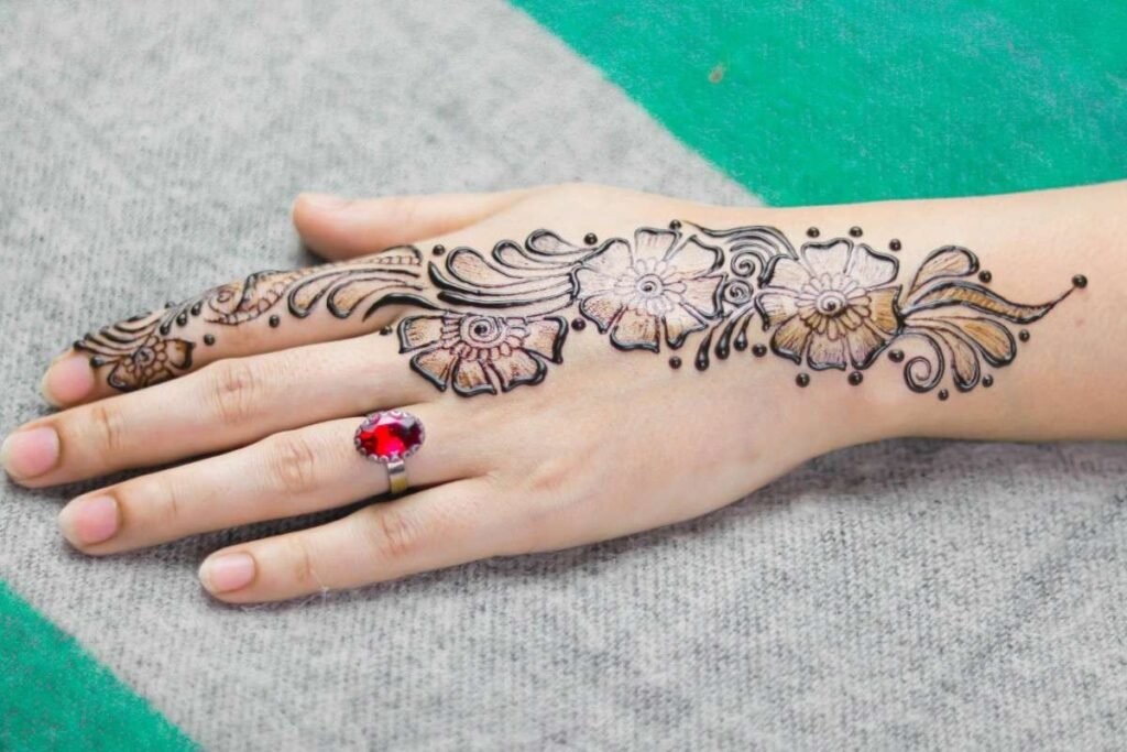 simple henna design on woman hand