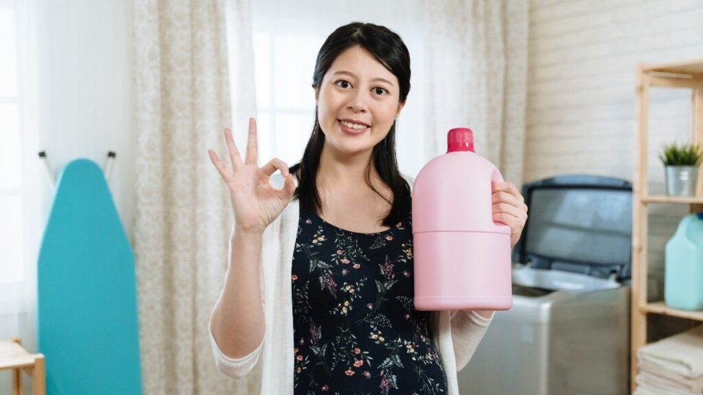 A woman with laundry detergent in hand