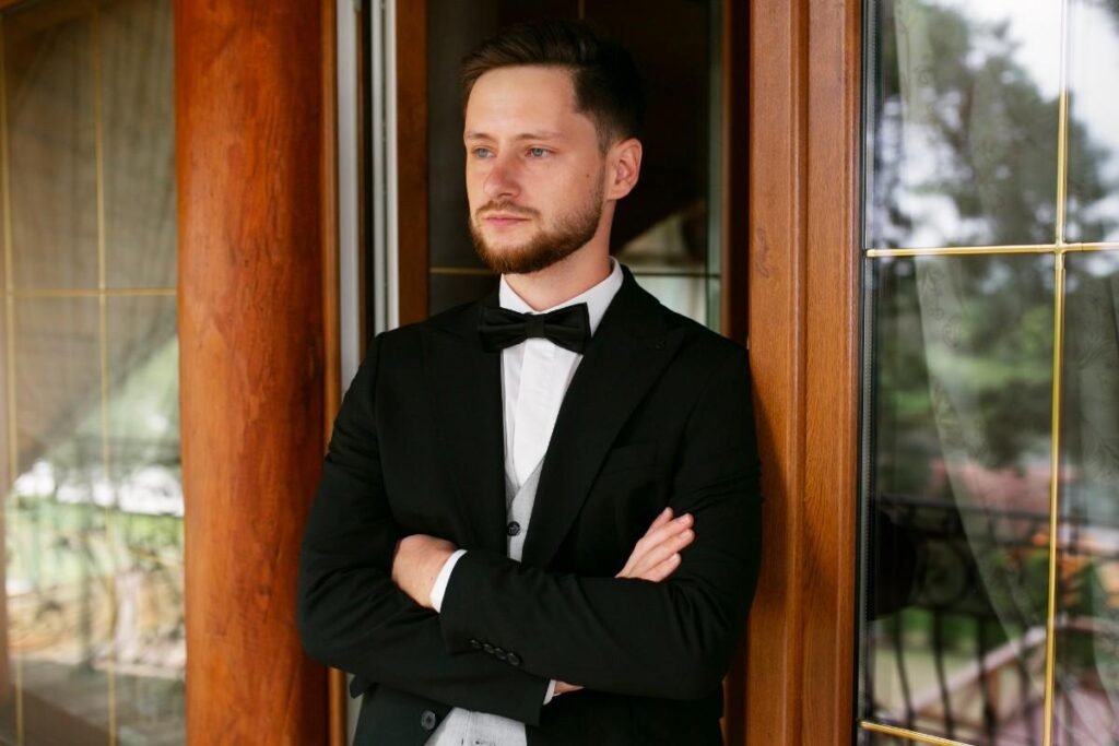 Front view of a handsome guy worn black tie attire