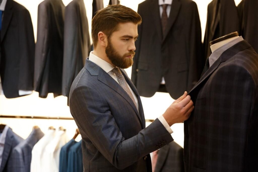 side view man choosing jacket shop