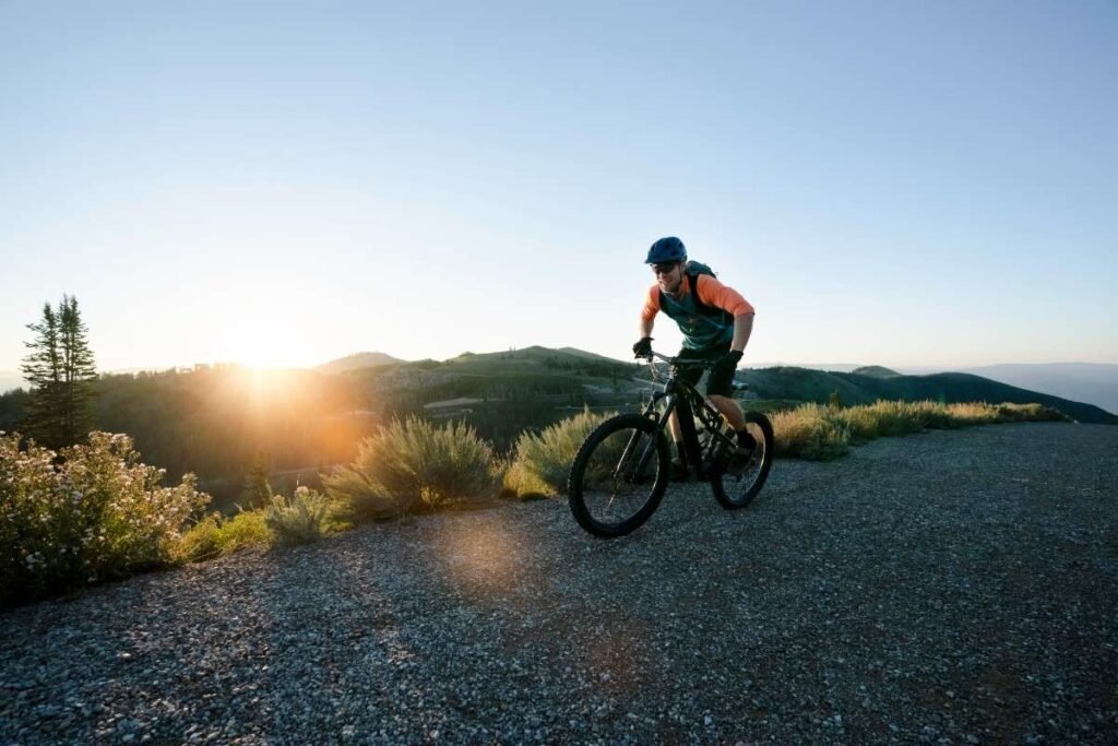 A biker with sun in background