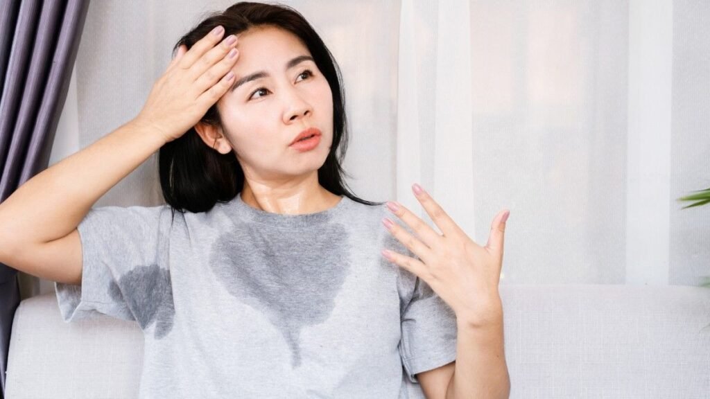 Asian woman sweating because of hot weather