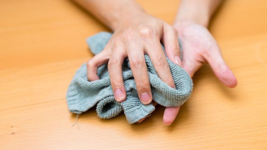 Woman suffer from hand perspiration dry up with towel