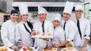 Team of cooks and chefs working in a catering business