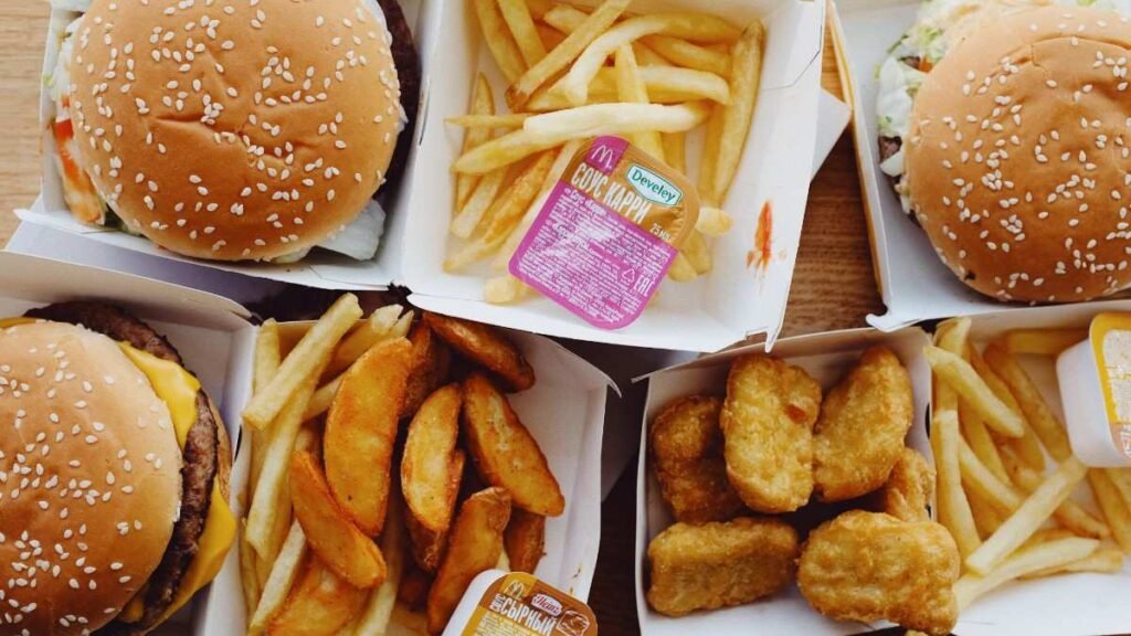 Fast food placed on wooden table