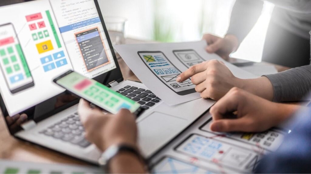 Graphic Designers Working on UX App Design