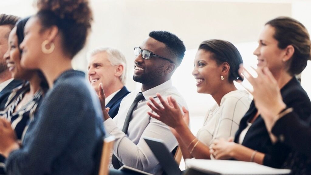 Employees Clapping during a Semina