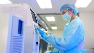 A medical scientist busy with Automated Analyzer