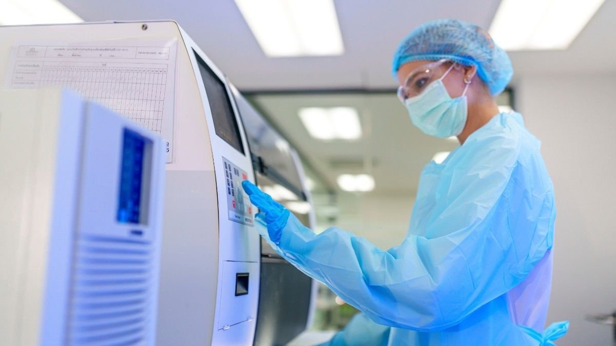 A medical scientist busy with Automated Analyzer